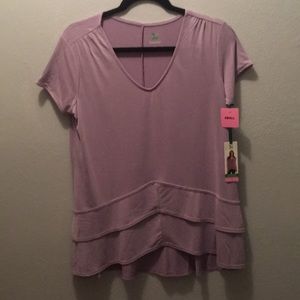 Short sleeve lavender top with V bottom.